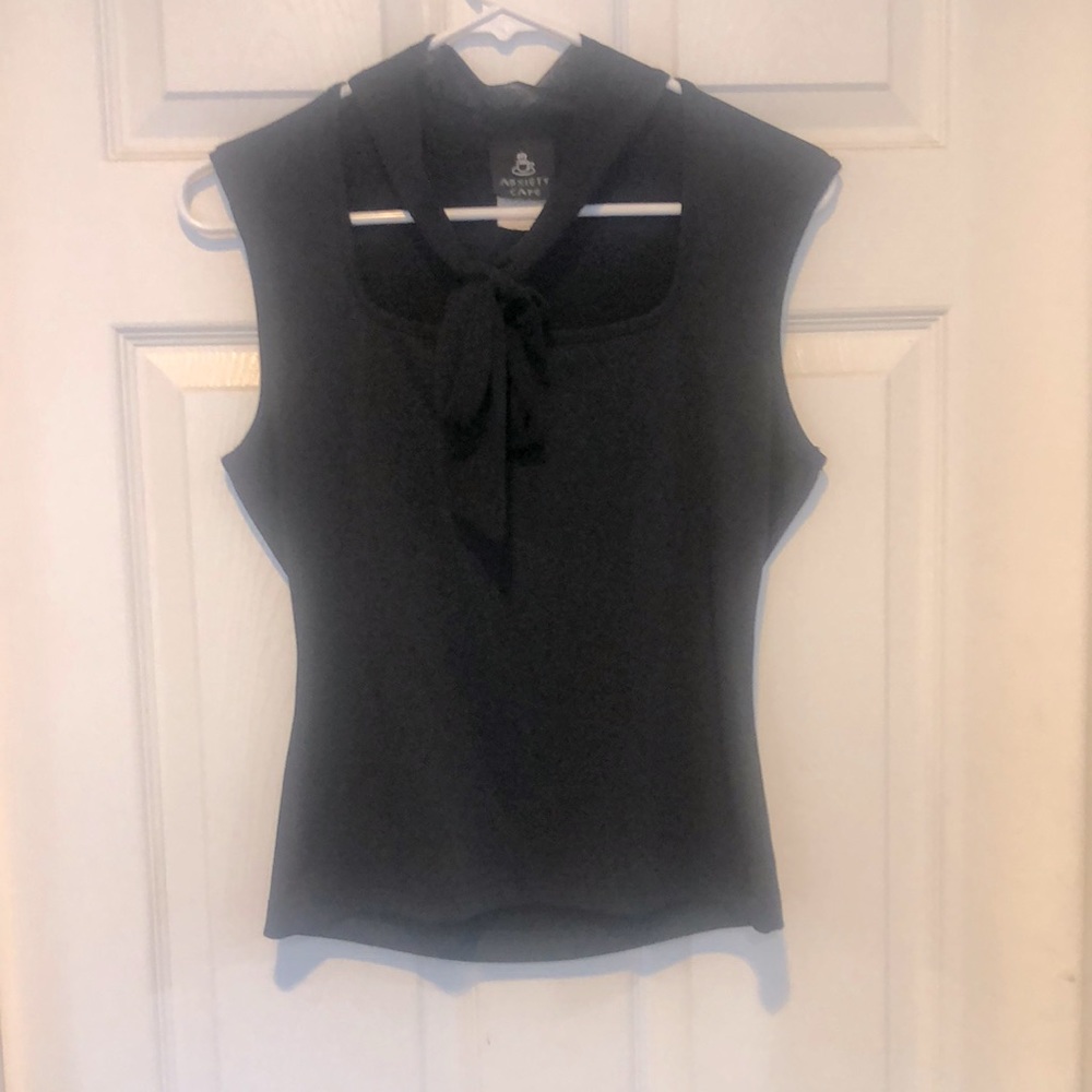 Classic black shirt , with neck tie which can be done numerous ways